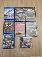 All eight game cases arranged on wood surface