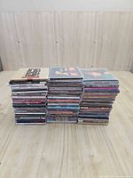 Front view of two stacks of CDs on table