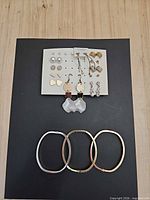 Group shot of earring card and three bangles