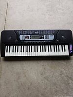 Full top view of RockJam RJ-654 keyboard showing 61 keys and speaker grilles
