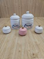 All five ceramic pieces with lids displayed