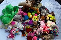 All stuffed animals spread on sheet showing quantity and variety