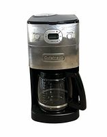 Front view showing stainless panel, digital controls, glass carafe