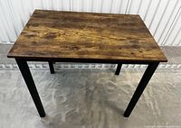 Full view of rectangular reclaimed wood desk with metal legs