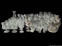 Full lot showing variety of clear glass barware and drinkware