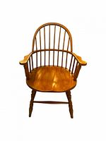 Front view showing spindle back, arms, seat and legs