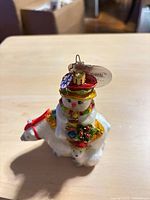 Front view of glass ornament with tag attached