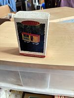 Front view of Hallmark Keepsake Mail Car ornament box