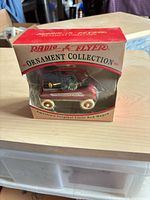 Front view of boxed Radio Flyer Little Red Wagon ornament