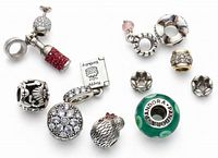 All 11 Pandora sterling silver charms grouped