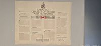 Bilingual English poster showing full layout with Coat of Arms, title, silhouettes, flag, Parliament image, Trudeau signature