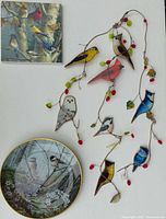 All three items grouped: square bird plaque, stained glass bird vine suncatcher, AK Kaiser plate