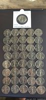 All 41 coins arranged, showing obverse Victory design, one coin in holder