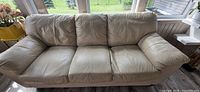 Front view of beige leather sofa