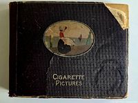 Front cover of album showing title, oval illustration, textured surface and corner damage