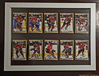Front view of framed display showing ten autographed cards