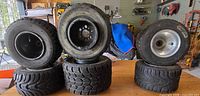 All six go-kart tire/rim assemblies displayed upright and stacked