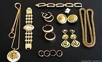 Full layout of jewellery items on black background
