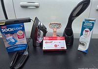 Front view of all boxed and loose items standing on table