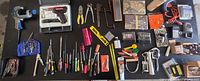 Full table view of assorted tools and hardware