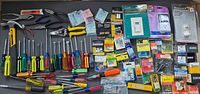 overview of all tools and packaged hardware spread on table