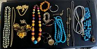 Overview of entire jewellery lot on black background