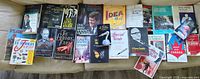 Wide shot of entire lot laid out on couch showing all books