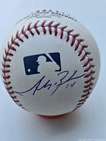 MLB logo side showing Mike Trout signature with #14 inscription