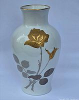 Front view of porcelain vase showing gold rose, silver leaves, and gilt rim
