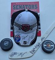 Hat, book, two pucks, partial mini stick