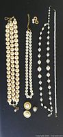 All jewellery items laid out on black background