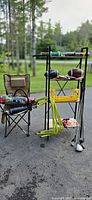 full lot with chair, hurdles, rack displaying bat, football and clubs