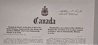 Close-up upper section showing coat of arms, header text and signature of Deputy Governor General