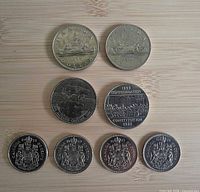 Front view of all eight coins arranged by type and date