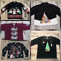 Collage showing all five sweaters front view