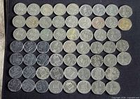 All 64 coins laid out in grid on dark background, obverse sides visible