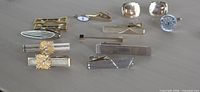 Group shot showing all cufflinks and tie clips