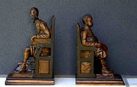 Front view of both carved wooden bookends