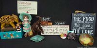 Entire lot overview showing all signs, figurines, pottery and trinket box