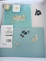 Overview of all opals in tray showing quantity and variety