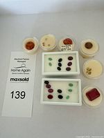 Full lot overview with display trays, gem jars and reference card visible