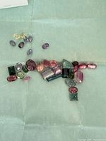 Group of faceted colored tourmalines and other stones