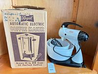 Sunbeam mixer with bowls beside boxed Regal coffee maker