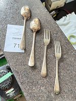 Group view of two forks and two spoons displaying overall style and tarnish