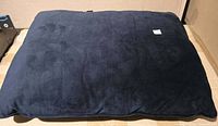 Full view of dark navy pillow top surface