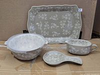 overview of platter, bowl with lid, sauce boat, spoon rest