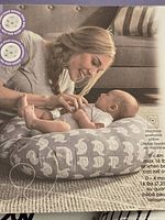 marketing image showing infant on the Boppy lounger