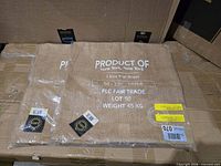 Front view of both pillow covers in packaging displaying Product Of print and labels