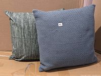 Both square pillows side by side