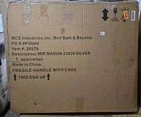 Front of sealed shipping box showing product description and dimensions